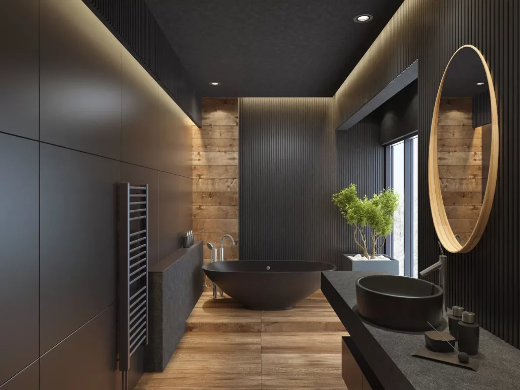 Luxury modern bathroom remodeling with black freestanding tub, wood accents, and sleek dark walls.